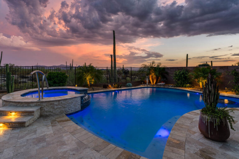 Custom gunite pool with above ground spill over hot tub built by 1st Choice Pools in Tucson